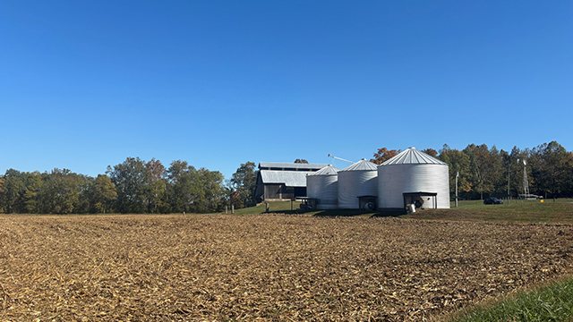 A large field with silos in it

Description automatically generated